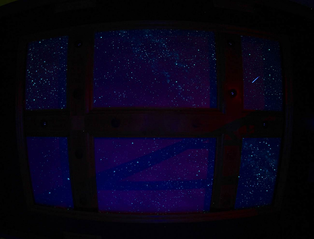 Dallas home theater star ceiling with black lights on, by Night Sky Murals