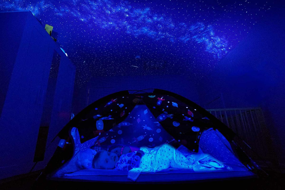 Kids camping under a Night Sky Mural star ceiling